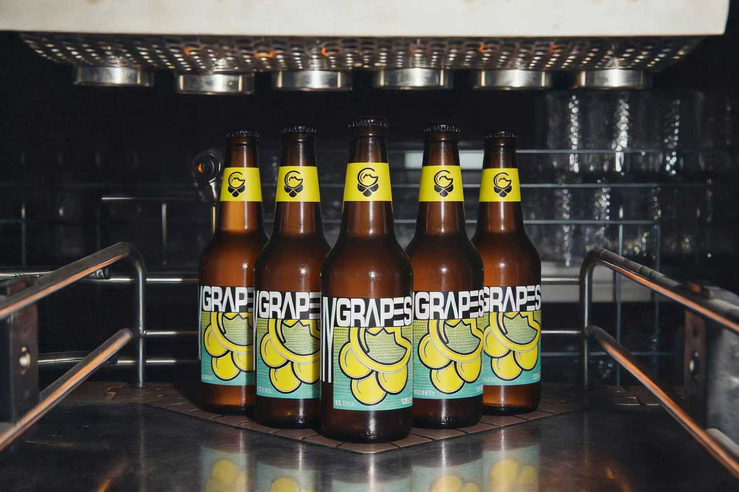 Low-alcohol wine bottles from MyGrapes arranged like bowling pins